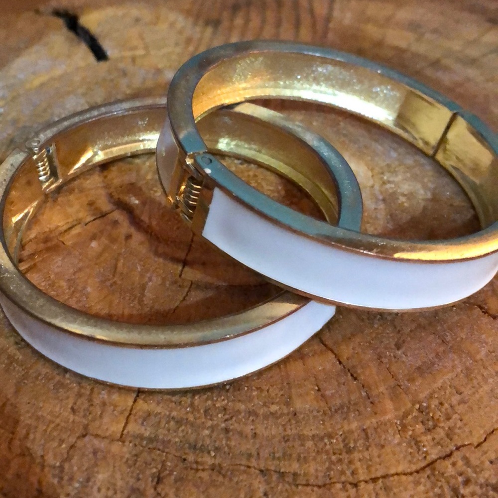 Gold and white cuff bracelets